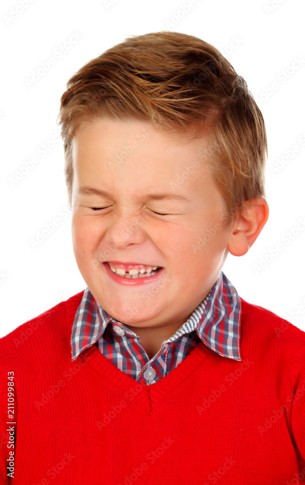 Blond child with a funny expression closing his eyes Blond child with a funny expression closing his eyes