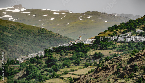 White Andalusian village of Capileira with Veleta peak photo