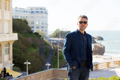 Handsome man. Outdoor male portrait. Middle-aged man, street photo, Biarritz, France.