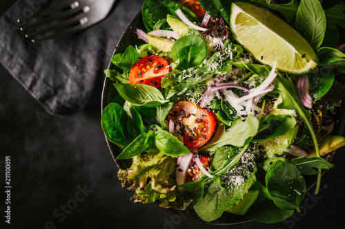 Detox tasty salad on dark table