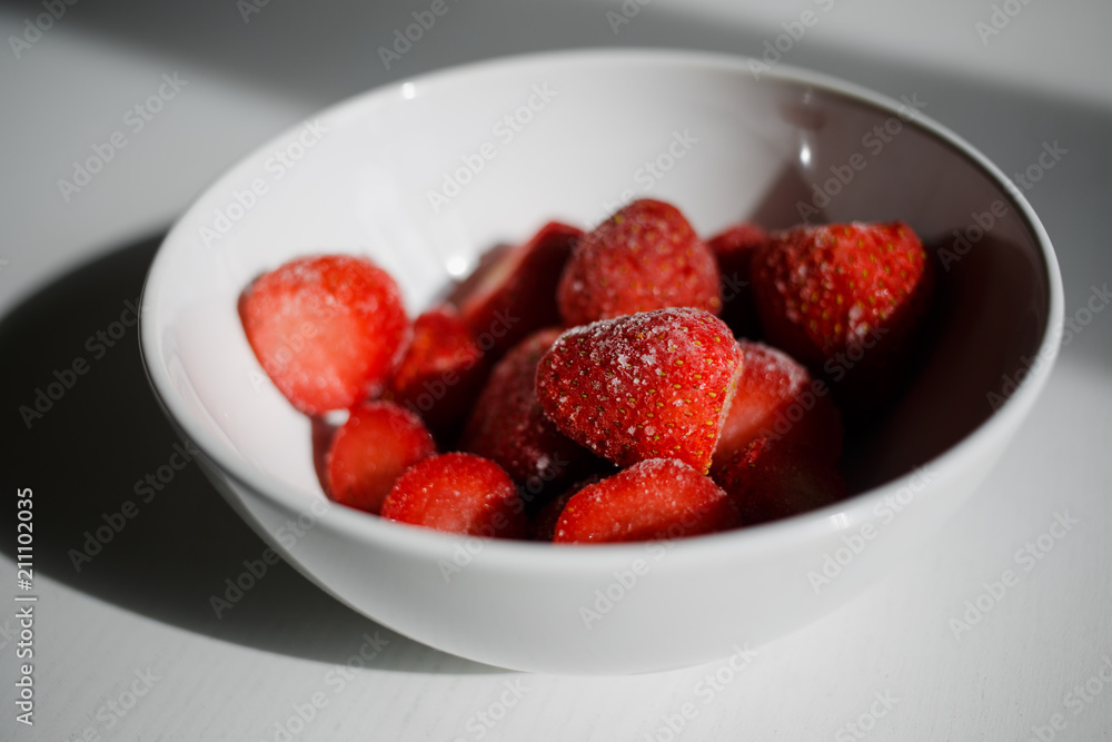 delicious, ripe, frozen strawberries in a white plate delicious, ripe, frozen strawberries in a white plate