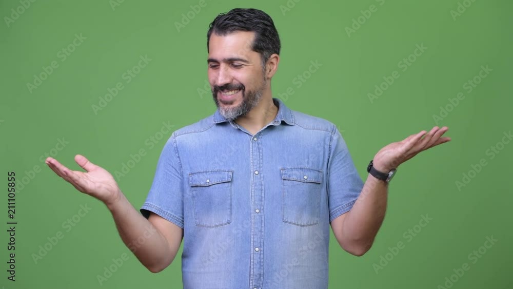 Handsome Persian bearded man choosing between left and right Handsome Persian bearded man choosing between left and right