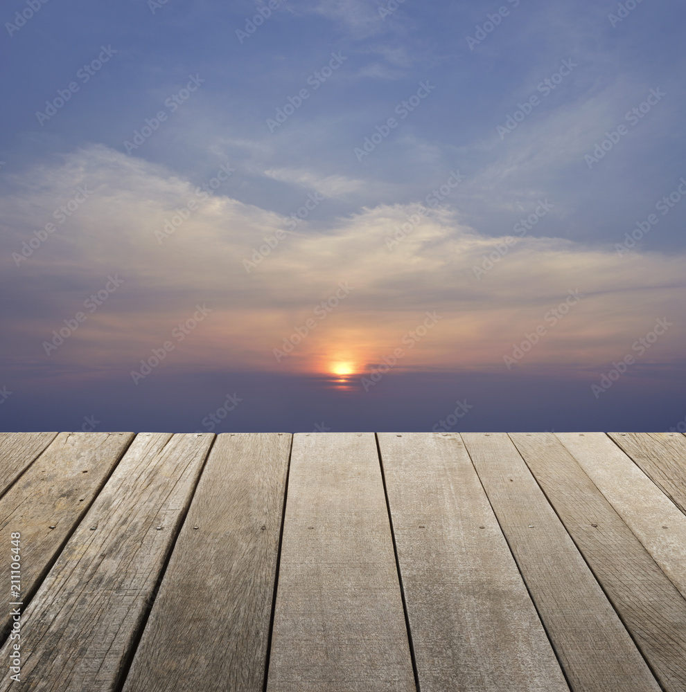 Empty old wood floor with sunset sky with clouds for background, for your product display montage Empty old wood floor with sunset sky with clouds for background, for your product display montage