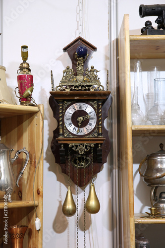 Antique wall clock with pendulum