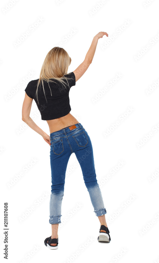 Back view of a woman dances. Back view of a woman dances.
