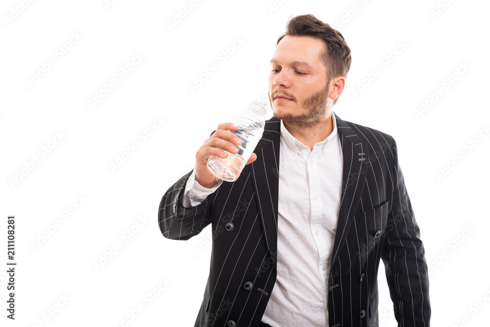 Portrait of business man drinking a bottle of water. Portrait of business man drinking a bottle of water.