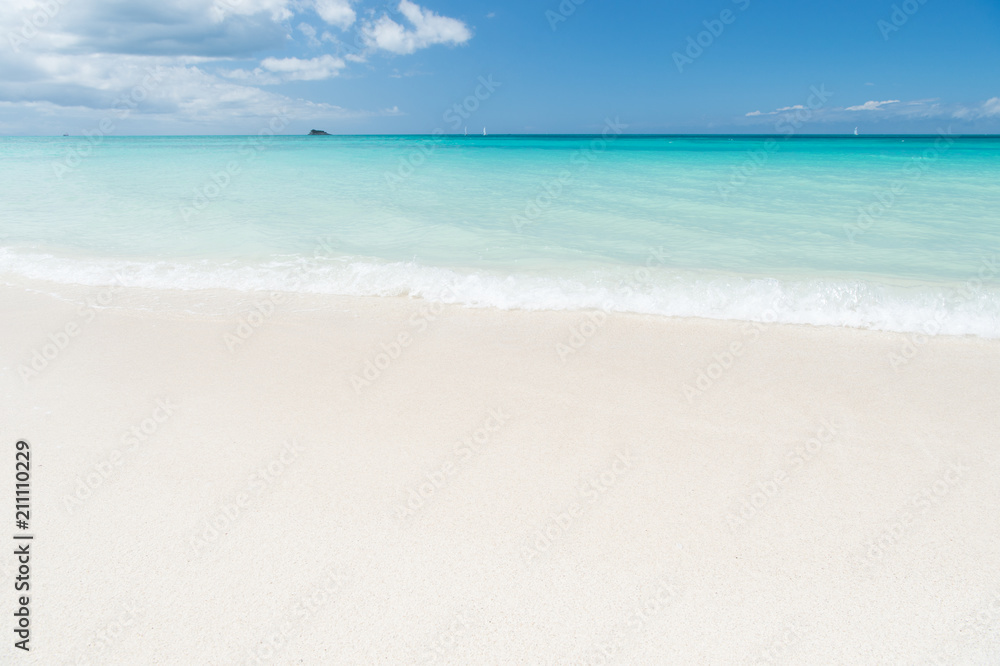 Uninhabited island. Sand pearlescent white claim as fine as powder. Clouds blue sky over calm sea beach tropical island. Tropical paradise beach with sand. Travel experts reveal Antigua best beaches
