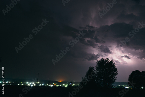 Night summer thunderstorm in the countryside. Night landscape