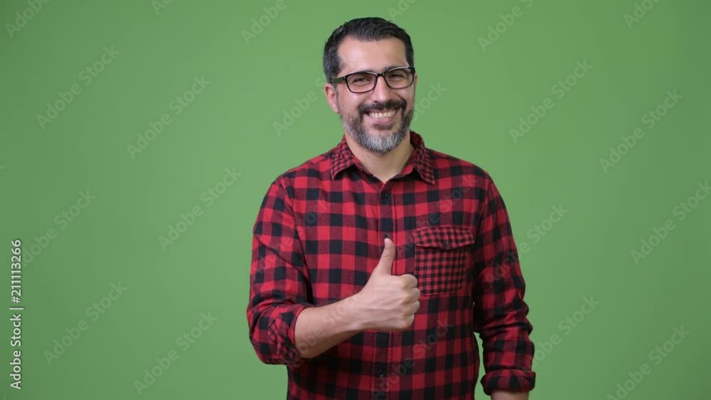 Handsome Persian bearded man giving thumbs up Handsome Persian bearded man giving thumbs up