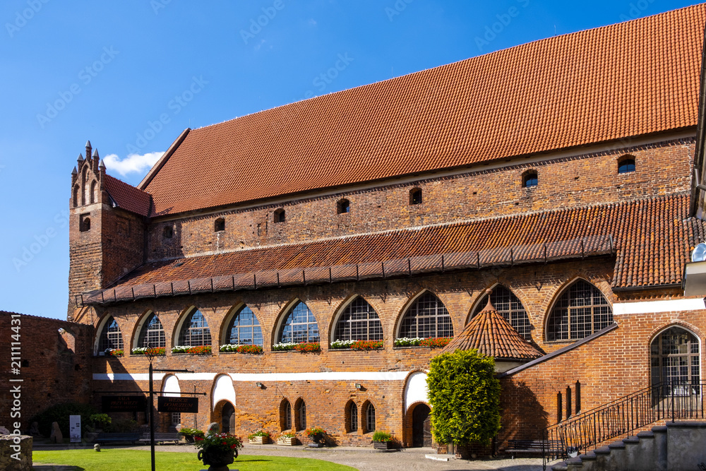 Fototapeta premium Olsztyn, Poland - Main wing and inner courtyard of the Warmian Bishops Castle in historical quarter of Olsztyn old town