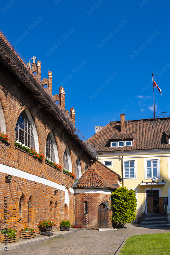Olsztyn, Poland - Main wing and inner courtyard of the Warmian Bishops Castle in historical quarter of Olsztyn old town
