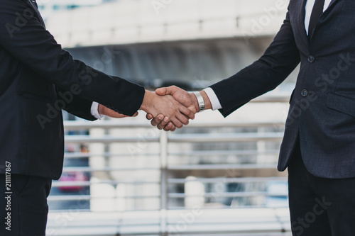 young successful businessman,Businessmen are shaking hands