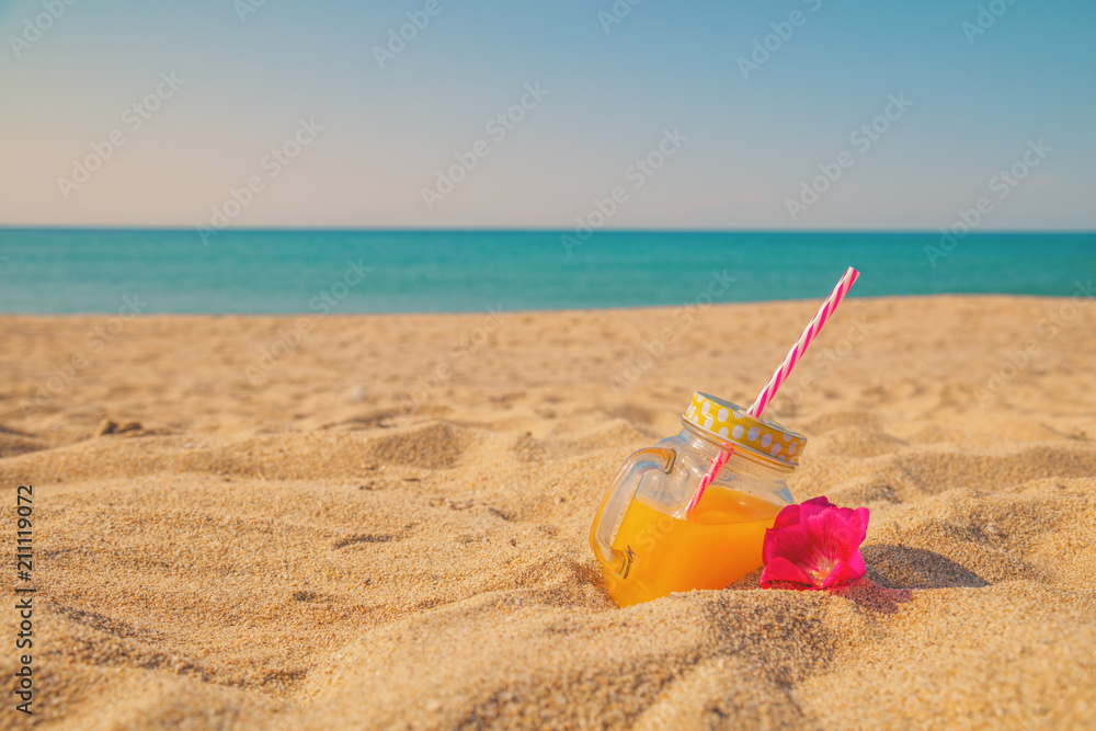 Juice in jar on the tropical sandy beach. Juice in jar on the tropical sandy beach.