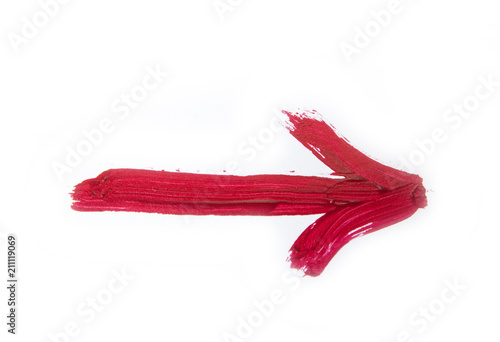 Red hand painted arrow with brush strokes isolated on the white background