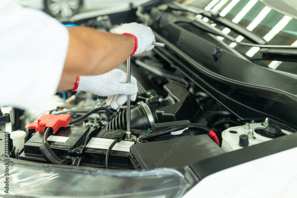 Auto mechanic working in garage, Car Repair Service center. Auto mechanic working in garage, Car Repair Service center.