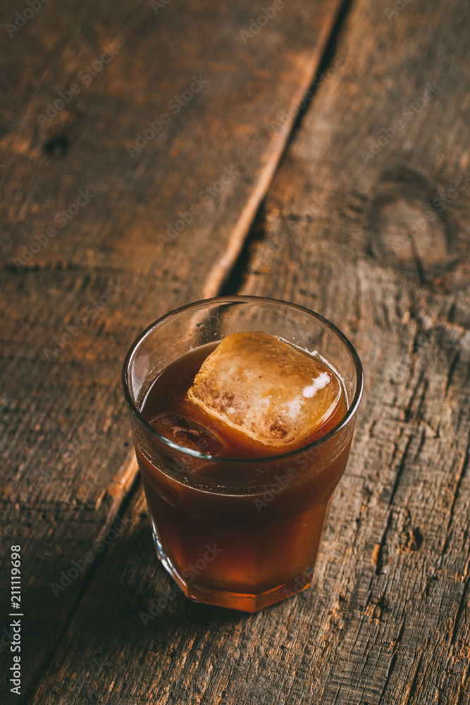 Ice cold brew coffee on wooden background Ice cold brew coffee on wooden background
