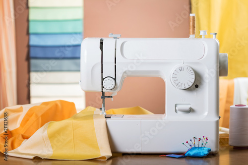 Piece of fabric under the presser foot of sewing machine