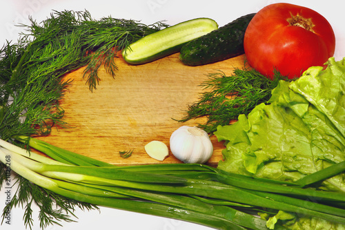 fresh vegetables for salad on a cutting board photo