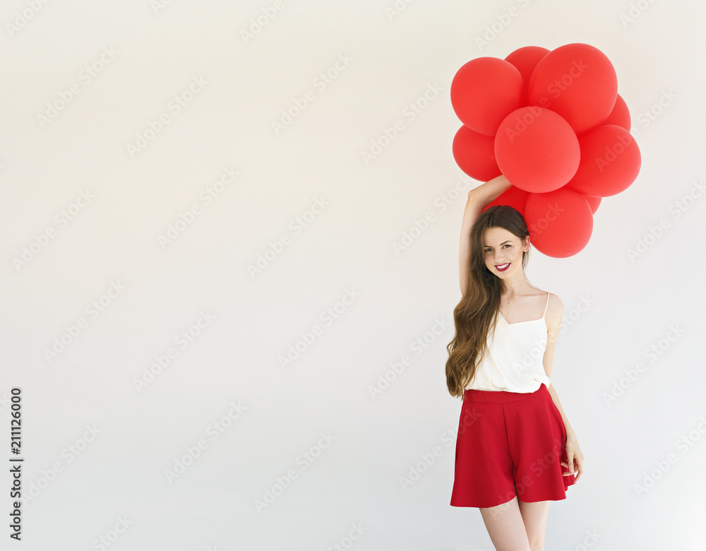 attractive young woman with red balloons on white background attractive young woman with red balloons on white background