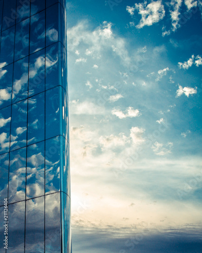 Close up of the mirrored water tower with reflections of clouds in Roald Dahl Plass  Cardiff Bay