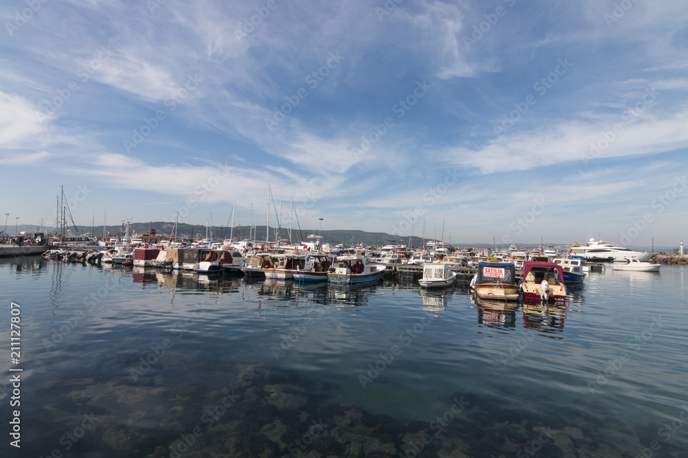 Fototapeta premium Canakkale, Turkey - October 15, 2017: Harbor of Canakkale in a cloudy day