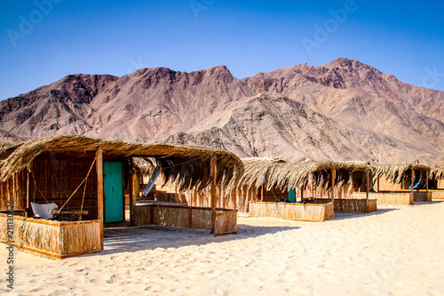 Simple bungalow style shacks at a desert beach resort in Nuweiba on the Red Sea coast of Egypt's Sinai Peninsula