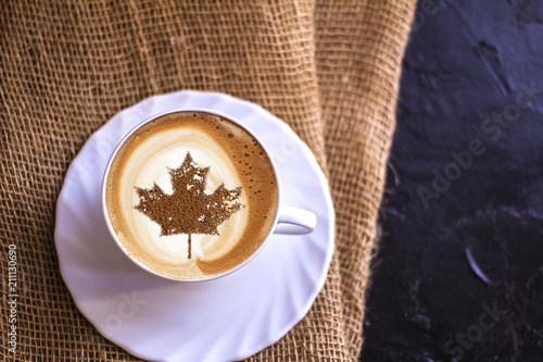 clover on a cup of coffee