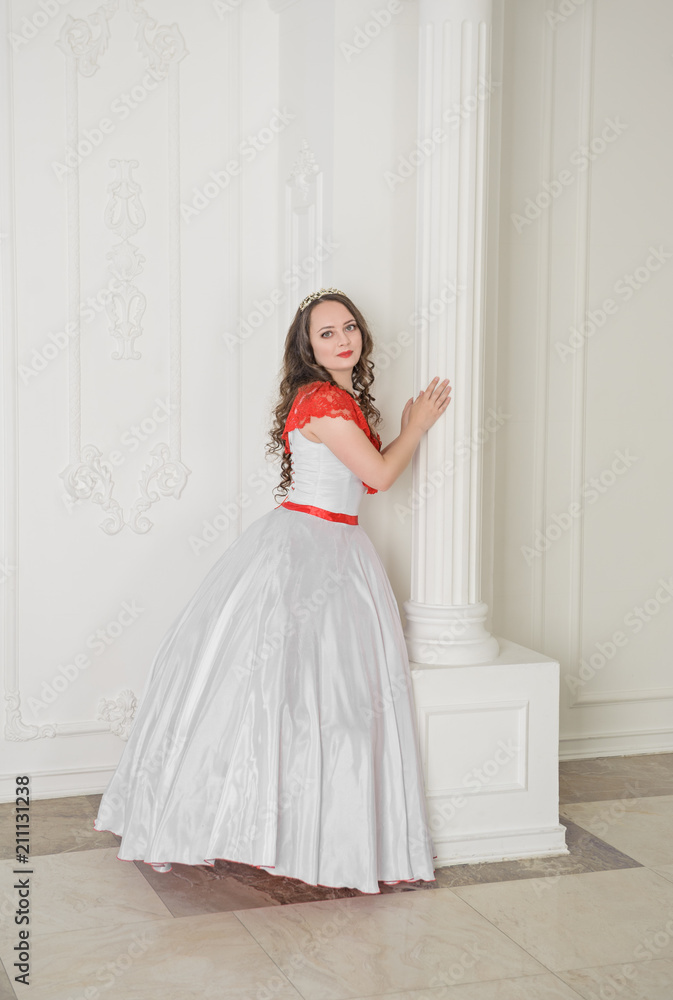 Beautiful woman in white and red medieval dress with crinoline Beautiful woman in white and red medieval dress with crinoline
