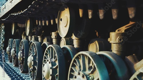 Soviet battle tank on a pedestal in a park with military equipment