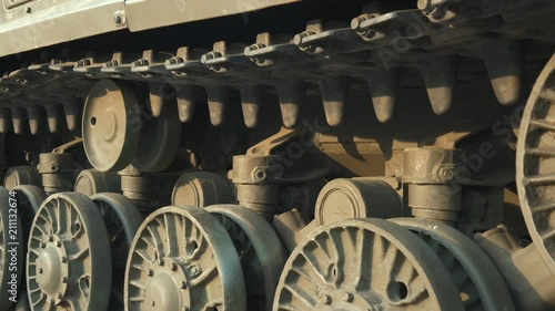 Soviet battle tank on a pedestal in a park with military equipment