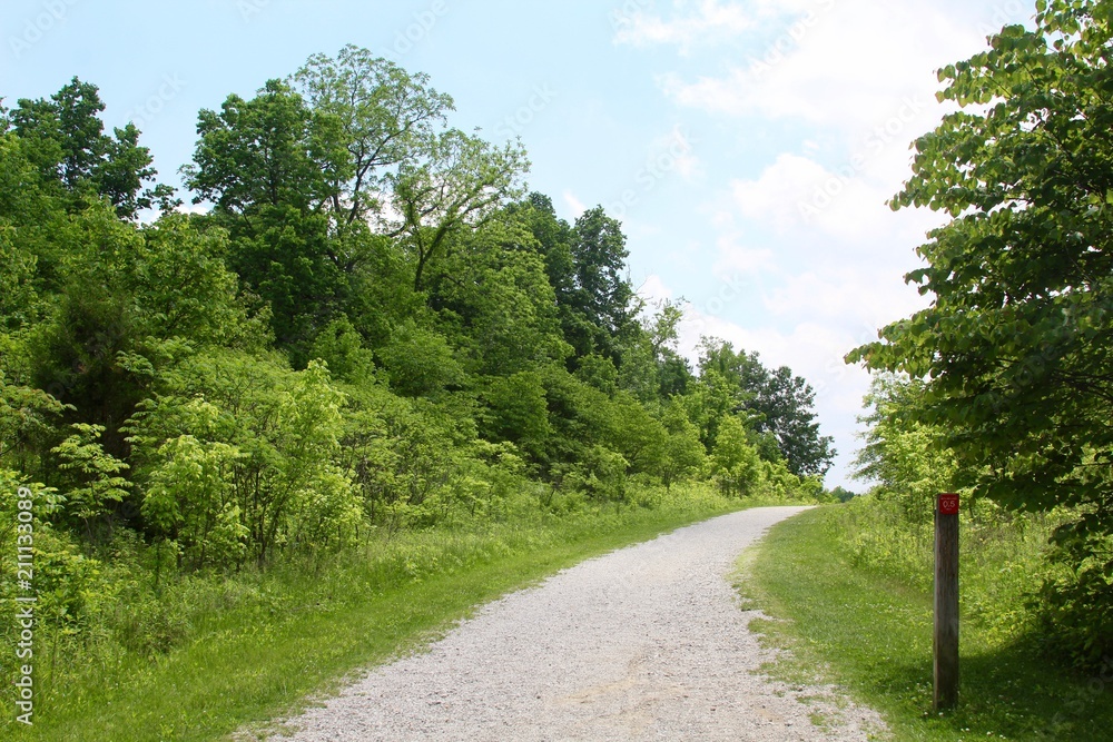 The long empty gravel trail in the countryside. 