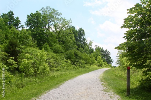 The long empty gravel trail in the countryside. 