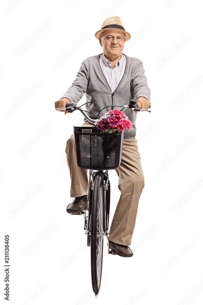 Fototapeta premium Mature man riding a bicycle towards the camera