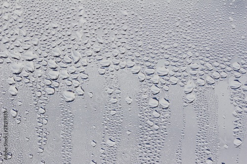 Macro view of water droplets condensation on a window pane