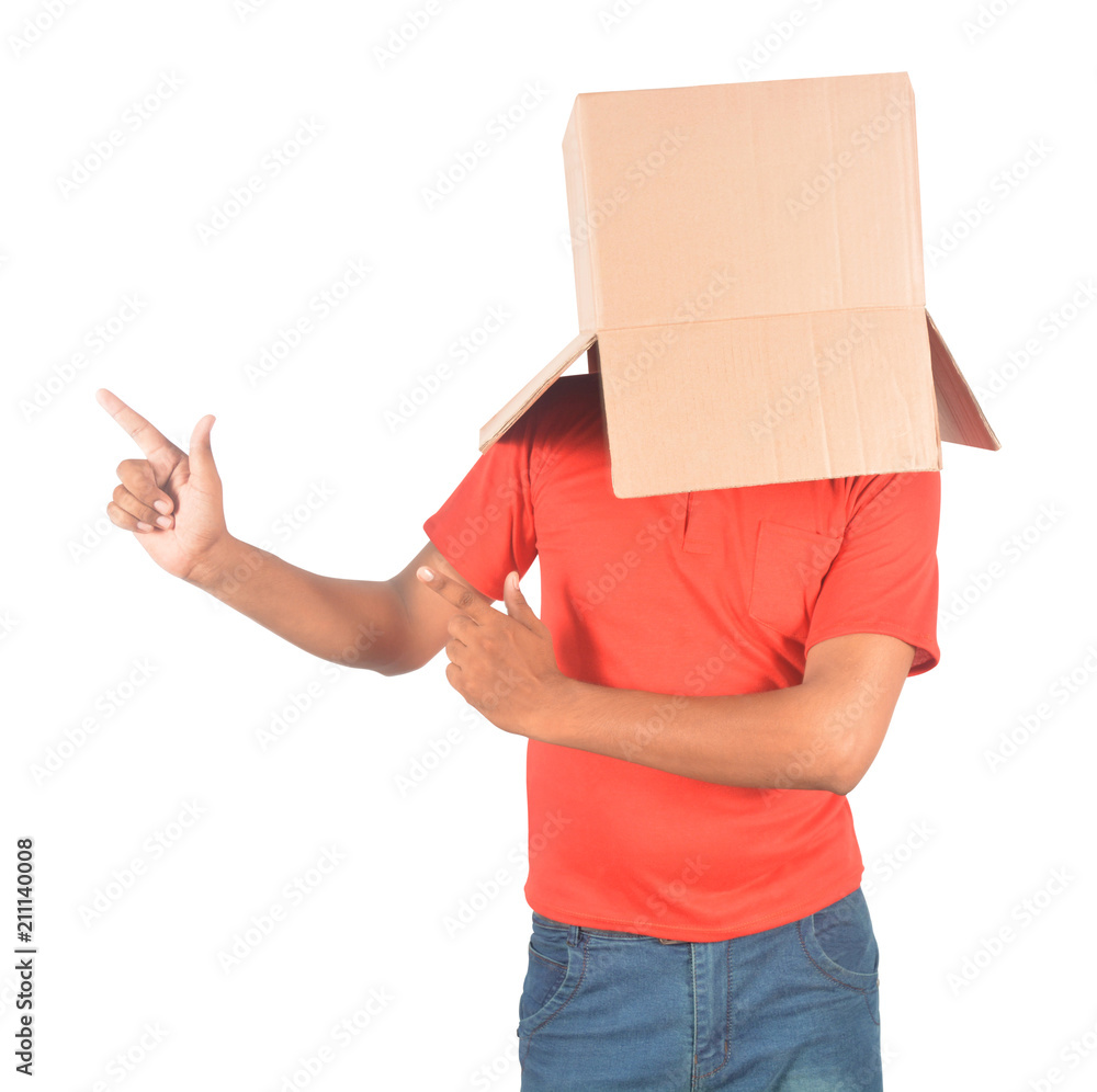 Young man standing and gesturing with a cardboard box on his head in uniform Young man standing and gesturing with a cardboard box on his head in uniform