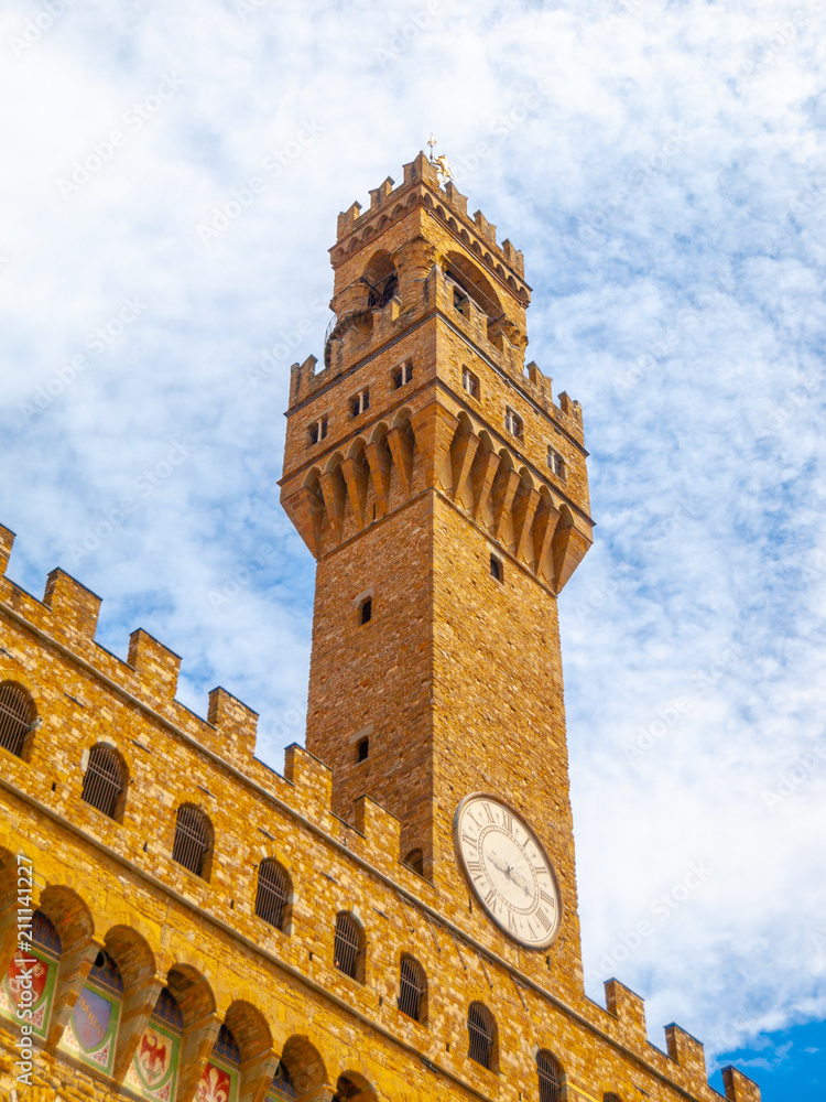 Bottom view of Pallazo Vecchio, Old Palace - Town Hall, with high bell tower, Piazza della Signoria, Florence, Tuscany, Italy.
