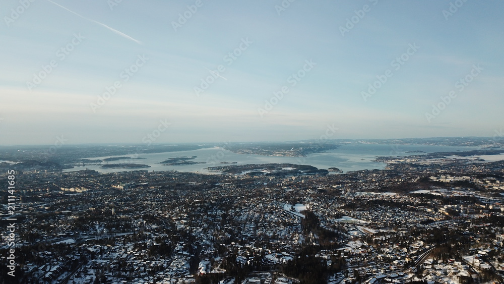 Obraz premium Aerial winter view of Oslo city and Oslofjord in Norway seen from Holmenkollen