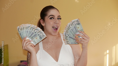 Winner girl - smiling face with lot of money