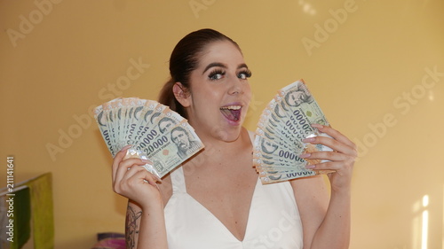 Winner girl - smiling face with lot of money