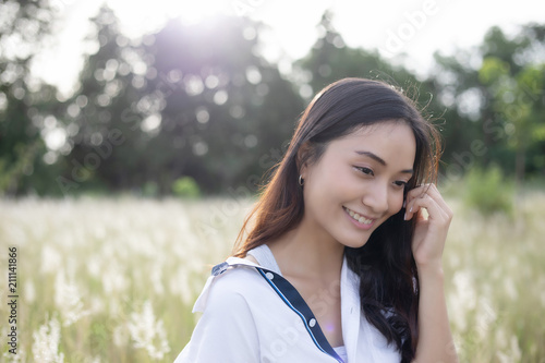 Wallpaper Mural Asian women happy smile on relaxing time at the meadow and grass Torontodigital.ca
