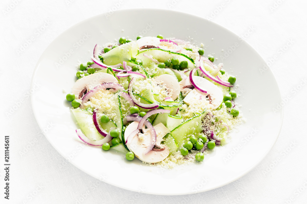 salad with fresh vegetables and raw champignons dressed with oil and white wine vinegar and sprinkled with parmesan salad with fresh vegetables and raw champignons dressed with oil and white wine vinegar and sprinkled with parmesan