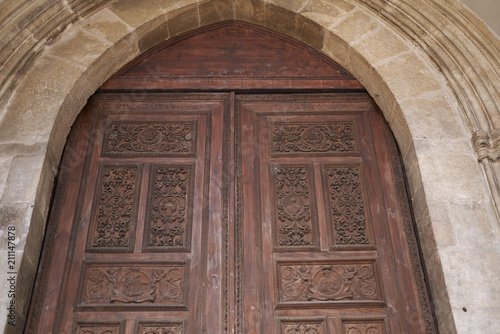 Cosenza, Italy - June 13, 2018 : Entrace wood door of San Domenico church