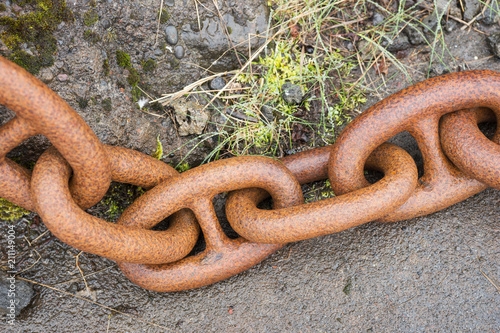 Closeup big rusty chain links. Closely and inseparably connected photo