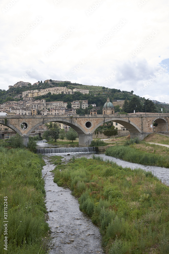 Cosenza, Italy - June 13, 2018 : View of Alarico bridge in Cosenza and the old town on the background