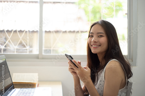 Free Download Pretty woman happy and smile for shoping online with her mobile - GFXLoad