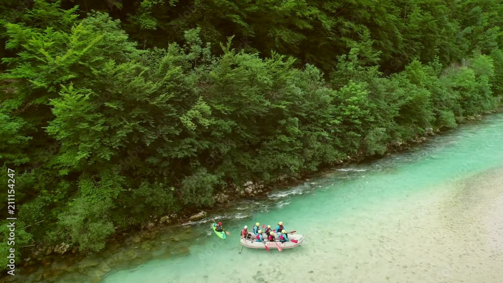 Aerial view of rafters doing rafting in turquoise water going down at Soca river Aerial view of rafters doing rafting in turquoise water going down at Soca river
