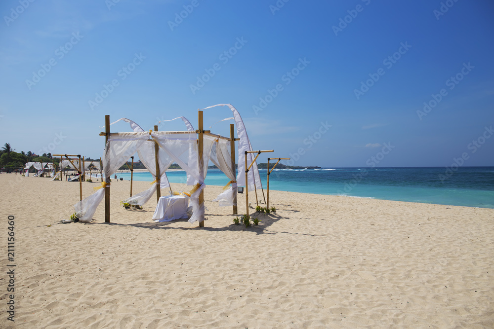 Gazebo on tropical sandy beach in Bali island,Indonesia Gazebo on tropical sandy beach in Bali island,Indonesia