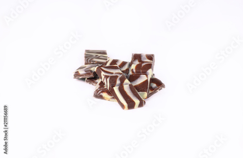 slices of original black and white chocolate.isolated on white