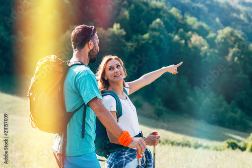 Hikers with backpacks walking at nature