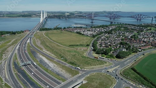 4K aerial footage of traffic on the approach roads to the Queensferry Crossing bridge across the Firth of Forth near Edinburgh.
